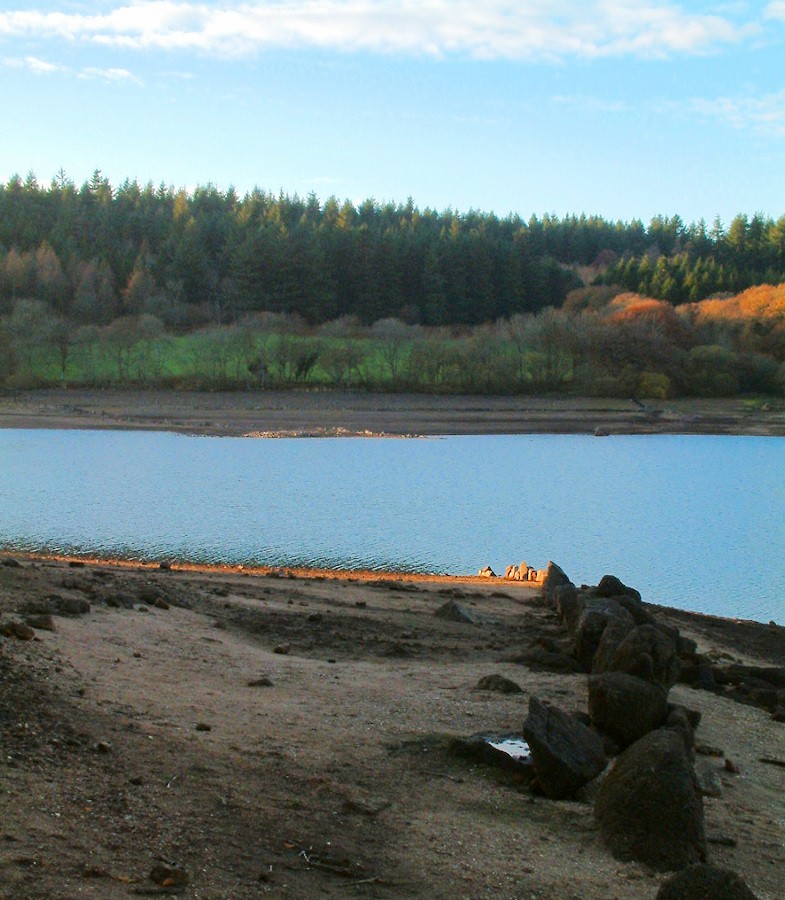 Remains of a wall and lane, under water when the reservoir is full